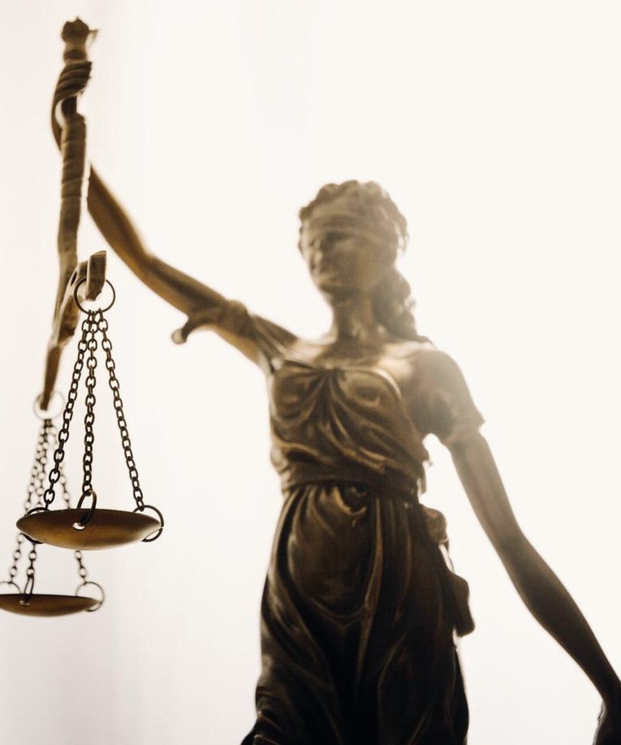 Bronze statue of Lady Justice holding the scales
